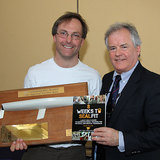 Troy Hopkins is presented with the Commodore's Trophy for 'Most Improved' 6357.jpg