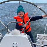 Harry George at the helm